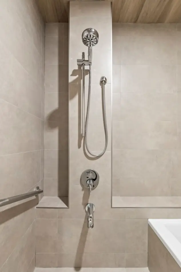Closeup of fixtures in custom ensuite wet room, built to support traditional Korean bathing rituals, renovated by Melanson Homes