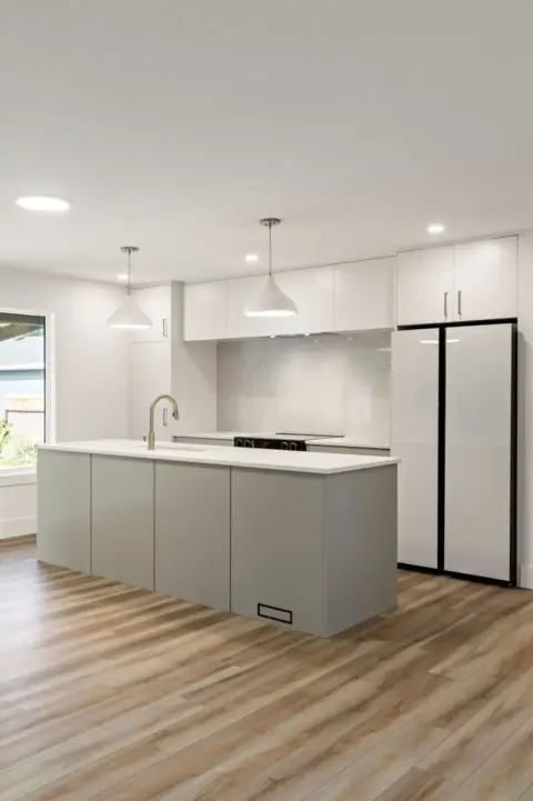 Sleek Japandi style kitchen with modern custom cabinetry after renovation