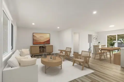 Open concept living room adjacent to dining room and kitchen in Japandi design inspired Varsity home