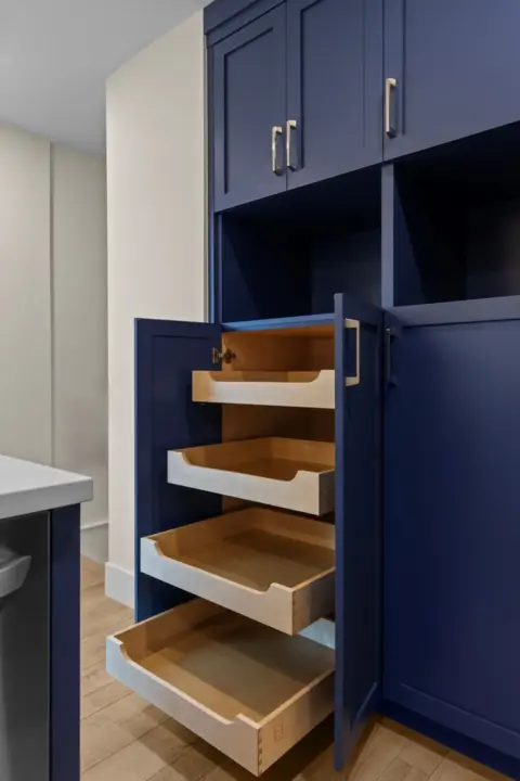 Pullout pantry doors in expanded and fully renovated Charleswood home