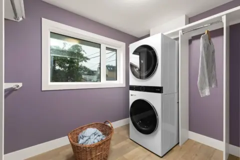 Refreshed laundry room in expanded and fully renovated Charleswood home