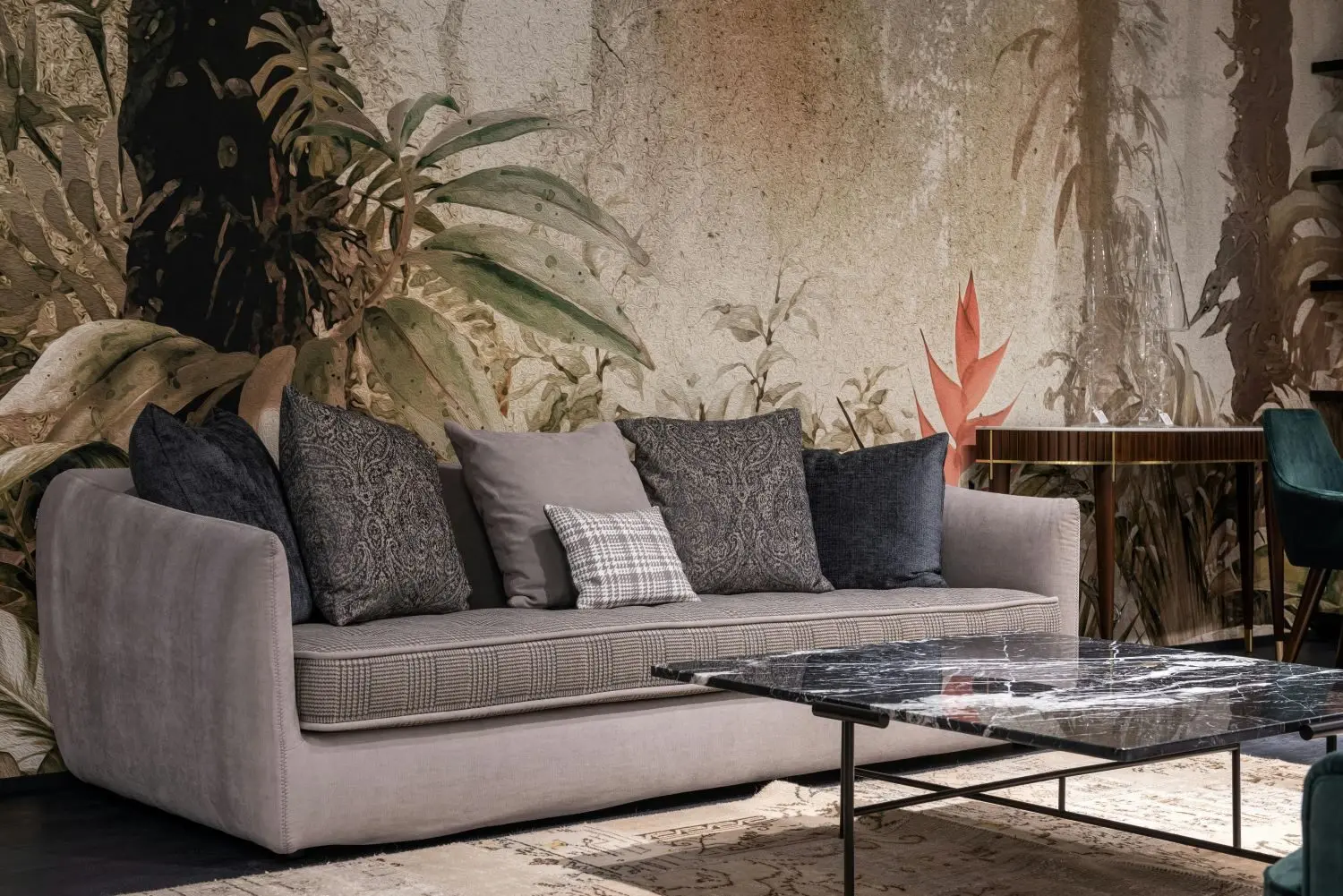 Oversized sofa with statement wall and floor coverings