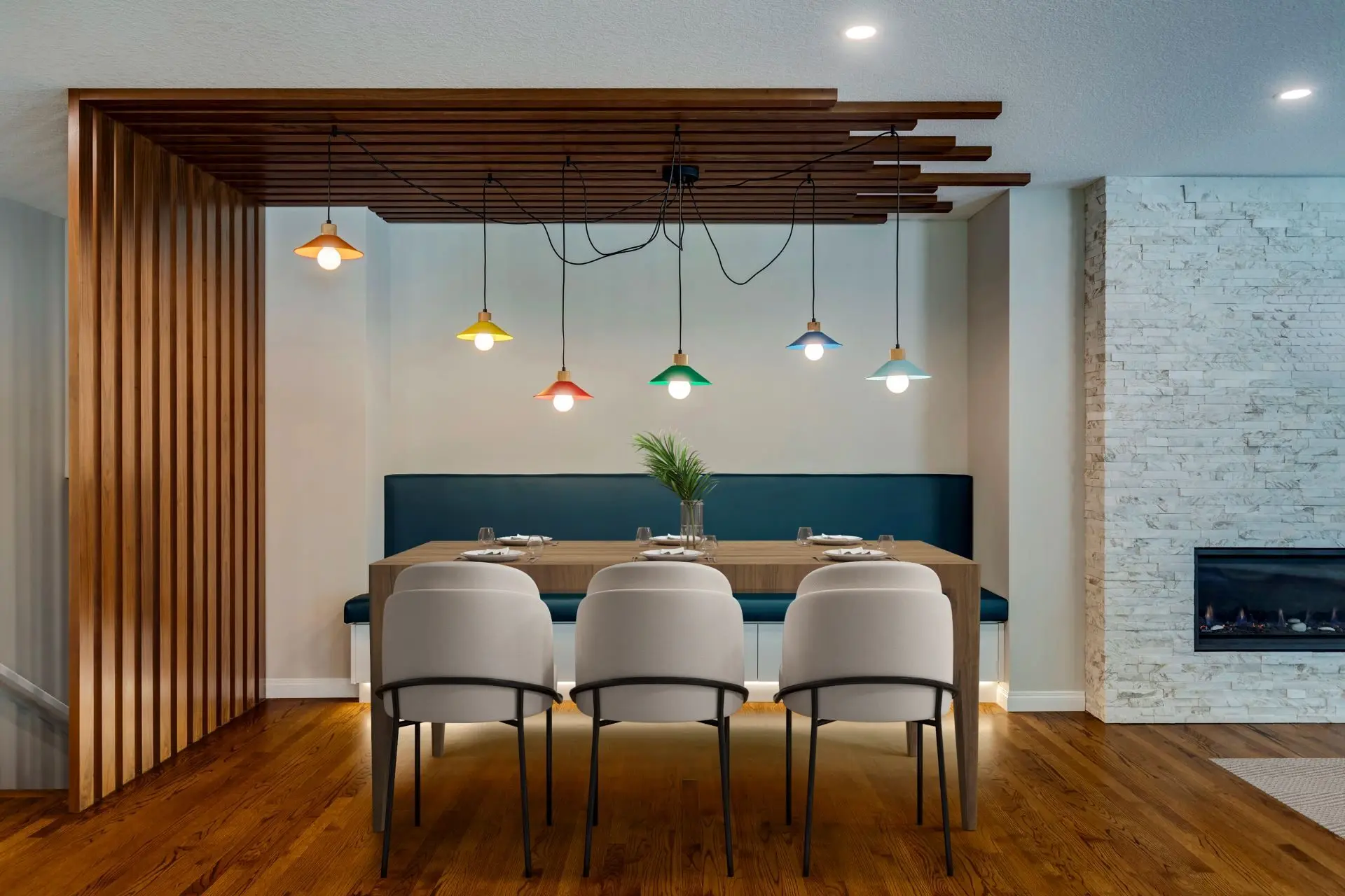Kitchen dining nook in Rocky View County home featuring unique wood slat feature and playful lighting fixture at dining nook