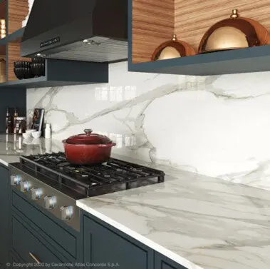 Kitchen featuring porcelain countertop and backsplash